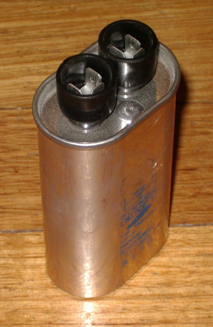 Pre - owned Sharp Microwave High - Voltage Capacitor with 1.07uF and 2200VAC Rating - Part Number RCQZA182WREO