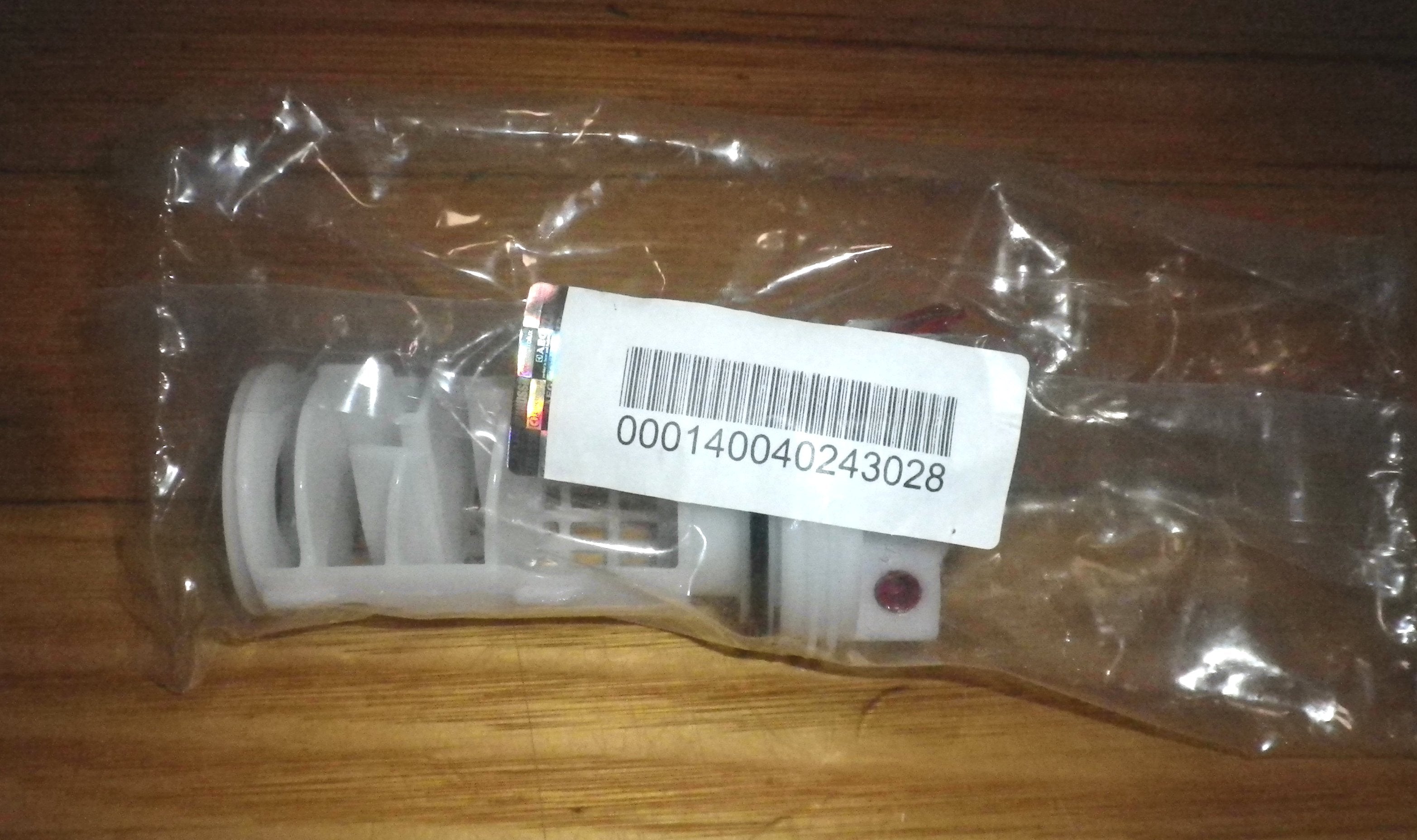 AEG and Electrolux Front Loader Washing Machine Pump Lint Filter and Button Trap Insert - Genuine Replacement Part # 140040243028