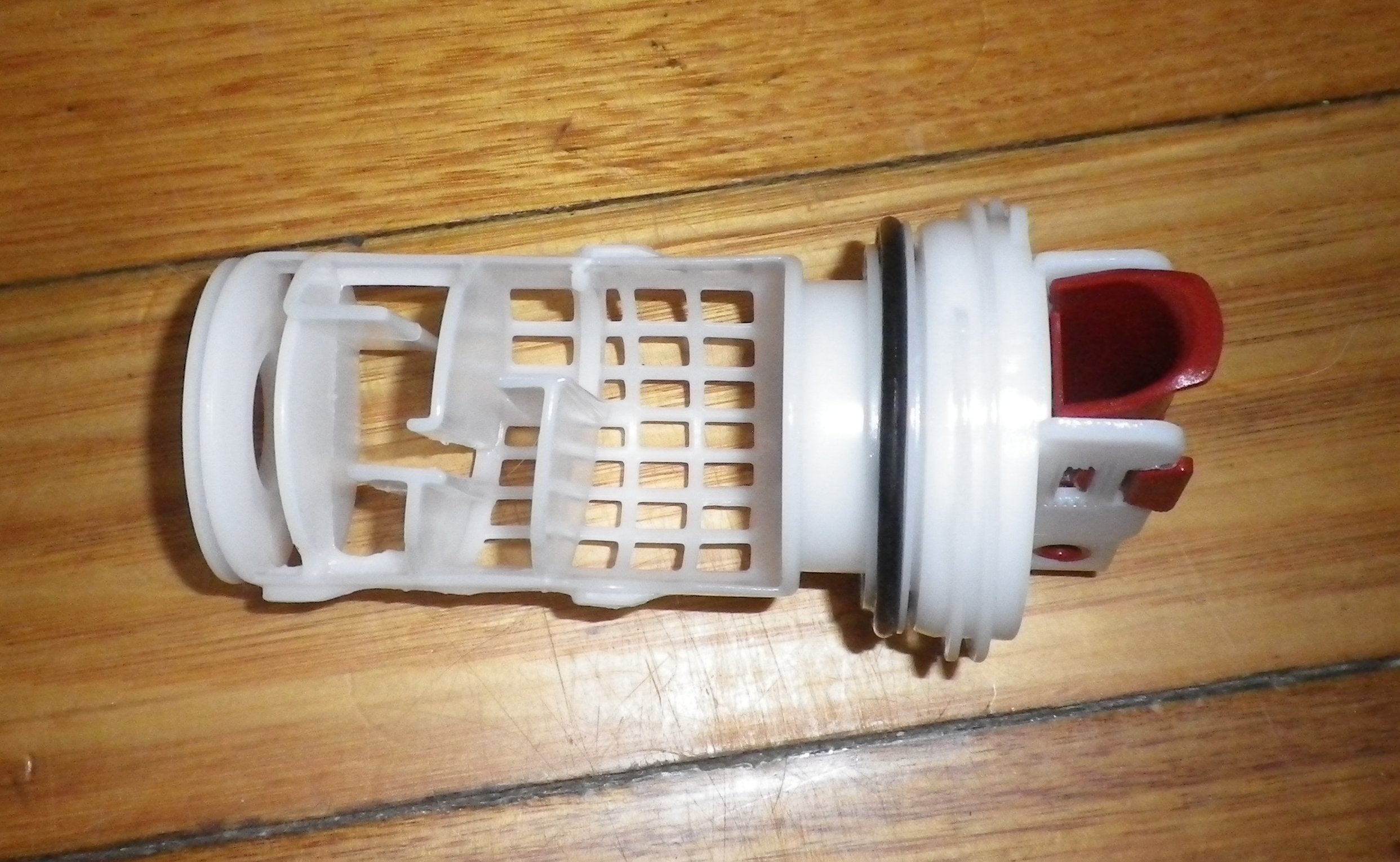 AEG and Electrolux Front Loader Washing Machine Pump Lint Filter and Button Trap Insert - Genuine Replacement Part # 140040243028