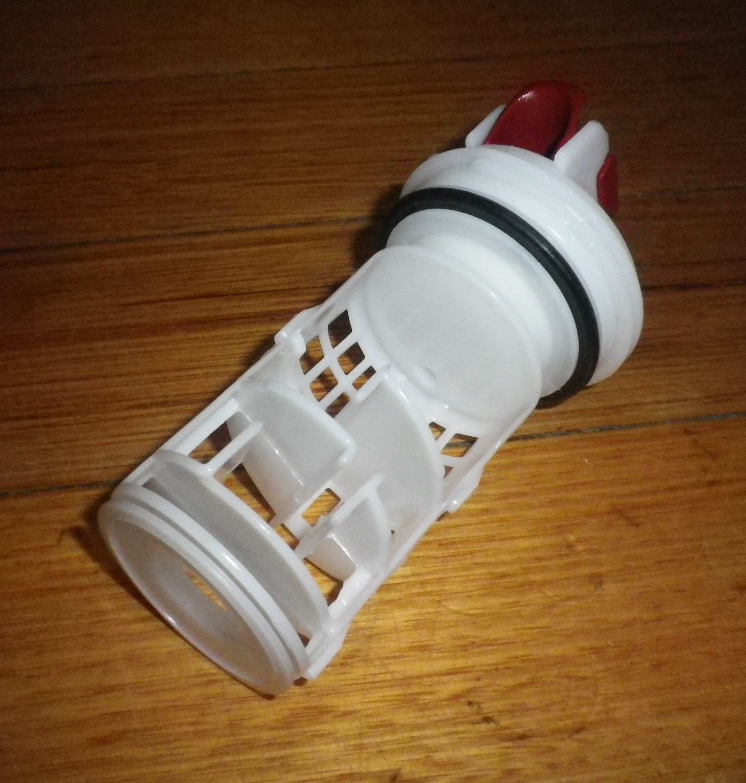 AEG and Electrolux Front Loader Washing Machine Pump Lint Filter and Button Trap Insert - Genuine Replacement Part # 140040243028
